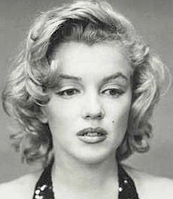 Marilyn Monroe in a troubled, far-away moment, captured by Richard Avedon, NY, May 1957. Click for related Marilyn photo books at Amazon.com.