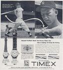 Mickey Mantle, famous New York Yankee slugger, gives a Timex watch a 'torture test,' 1950s.