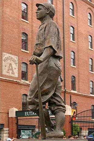 Statue of a young Babe Ruth just outside the gates of Oriole Park at Camden Yards, Baltimore. Statue by Susan Luery; photo by Leo Cloutier, pbase.com. See other statue perspective, below.
