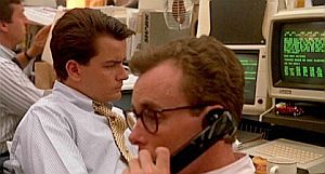 Bud Fox at trading desk with colleague Marv.