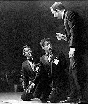 Dean Martin, Sammy Davis, Jr., and Frank Sinatra on stage during one of their performances, 1960s. Dean Martin, Sammy Davis, Jr., and Frank Sinatra on stage during one of their performances, 1960s.