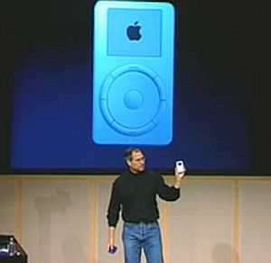 Steve Jobs on stage, October 23, 2001, introducing the first iPod digital music player.