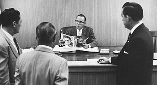 Aug 1956: Members of the Jacksonville, FL Optimist Club meeting with Judge Gooding (reading Elvis material), to discuss curbing Presley's concert. Life photo. Aug 1956: Members of the Jacksonville, FL Optimist Club meeting with Judge Gooding (reading Elvis material), to discuss curbing Presley's concert. Life photo.