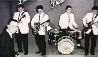 Early 1960s: Brian Lamb, left, with musical guests on “Dance Date” TV program. Cable Center video.