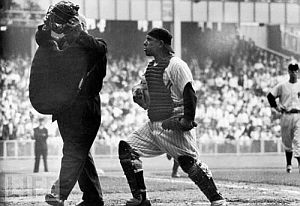 1955: Yogi Berra continues to show his displeasure with Robinson call, pressing his case, but to no avail.
