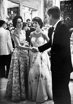 July 1957: Jack and Jackie (then pregnant) at Tiffany benefit ball at Marble House in Newport, RI.  JFK is greeting socialite Mrs. John Drexel III.  Photo, Life / Ralph Morse.
