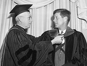 Feb. 1958, NY: Laurence J. McGinley, president of Fordham University, presents Senator Kennedy with honorary degree at  Fordham Law Association luncheon.