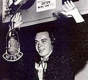 Alan Freed in the 1950s, likely hosting a live stage show in the New York city area, broadcast over WINS radio.