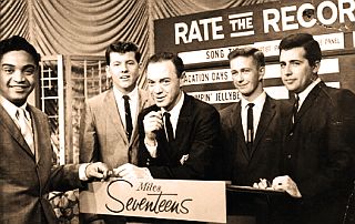 In 1957, Alan Freed briefly had his own ABC-TV dance show.  He is shown here at center, with Jackie Wilson, far left, and Jimmy Clanton, left of Freed, and others.