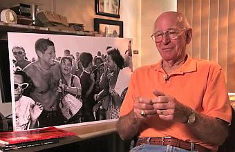 Photographer Bill Beebe, at home with the famous 1962 JFK beach photo he snapped, during an interview in 2011. 
