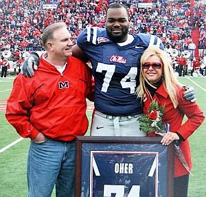 Sean Touhy, Michael Oher & Leigh Anne Touhy at University of Mississippi football game.