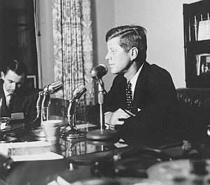 Feb 6, 1960: JFK makes a quick trip to Charleston, WV to file for the state’s May 10th primary election where he will face Sen. Hubert Humphrey. Kennedy, at the desk of State Secretary Joe Burdette, is talking with the press. At left is Neil Boggs of WSAZ. Photo, WV State Archives.