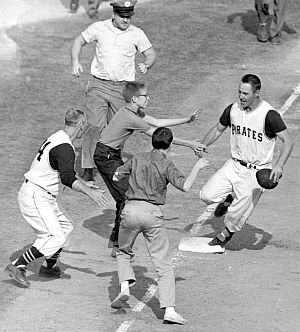 At 3rd base, well-wishing fans begin to greet Maz as Pirate third base coach, Frank Oceak, joins the party.