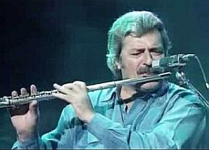 Moody Blues band member Ray Thomas, author of “Legend of a Mind,” during flute solo in later years.