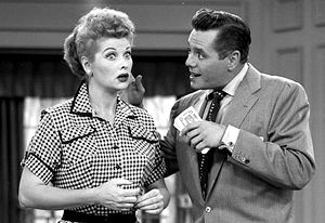 Ricky & Lucy discuss some mysteriously discovered cash in a 1950s episode of “I Love Lucy.”