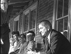 April 1964: President Lyndon B. Johnson during a visit with Tom Fletcher and family in Inez, Kentucky announcing his “War on Poverty” program. 