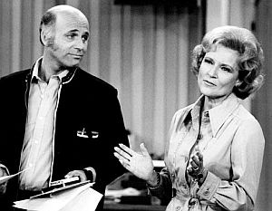 Newswriter Murray Slaughter listening to comment by Happy Homemaker show host, Sue Ann Nivens.