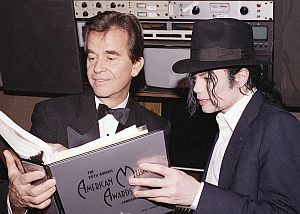 January 1993: Dick Clark with Michael Jackson paging through American Music Awards booklet.
