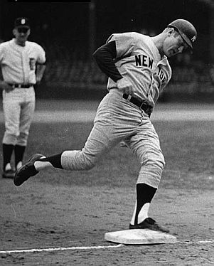 Detroit Tigers infielder Don Wert watches Mickey Mantle circle the bases after hitting his 535th career home run, Sept. 19, 1968.