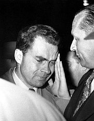 Nixon in some consternation after September 1952 meeting with Ike. Senator William Knowland is at right.