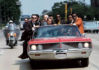 Bobby Kennedy campaigning in Indianapolis, May 1968. Behind Kennedy to the right, are NFL football stars Lamar Lundy, Rosey Grier and Deacon Jones. Photo by Bill Eppridge from his book, 'A Time It Was'. Click for book.