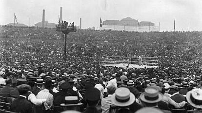 This photo provides a partial view of the huge crowd surrounding the outdoor boxing ring at the Dempsey-Carpentier fight in Jersey City, NJ, July 2, 1921.