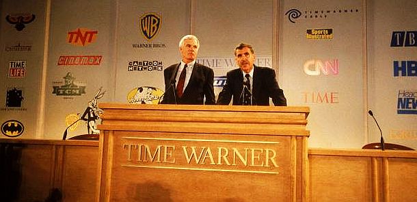 Sept 1995: Ted Turner with Time-Warner chairman Gerald Levin as the two men held a press conference in New York on their planned merger. Background panels display the logos of the various Turner and Time-Warner companies that would come together in the new media giant.