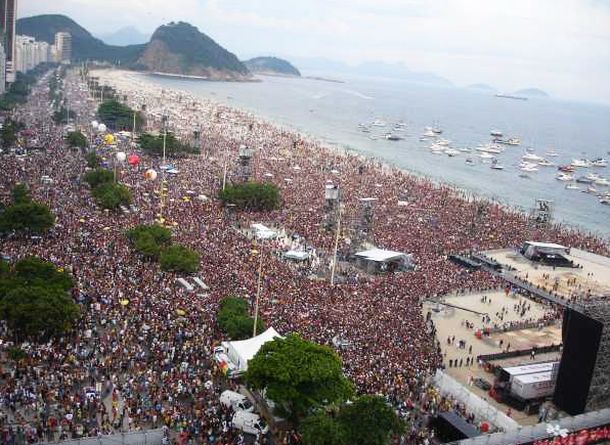 Seaside streets & Copacabana Beach in Rio de Janeiro, Brazil, 'filling up' with hundreds of thousands of onlookers & fans during the evening prior to Rolling Stones’ concert, February 2006.