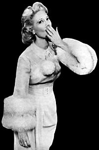 Dinah Shore in her classic ‘throwing-a-kiss’ pose which often came at the end of her ‘See-The-USA’ song on her 1950s TV show.