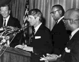 Robert Kennedy with other officials at announcement of Bedford-Styvesant initiative, December 10, 1966.