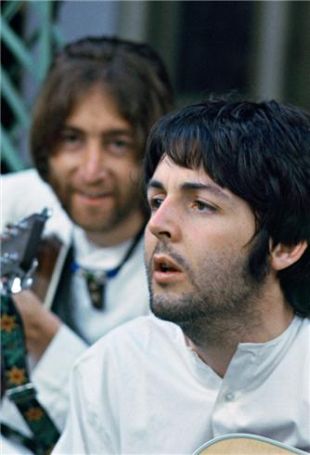 John Lennon, background, and Paul McCartney, working on their music in Rishikesh, India during a 1968 visit there with the Maharishi Mahesh Yogi. The song, ‘Dear Prudence,’ about a woman in the group there, Prudence Farrow, was written by John Lennon.   