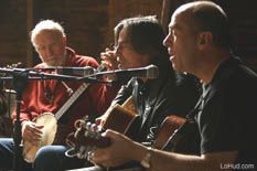 Pete Seeger, Jackson Browne, and John Hall playing some music.