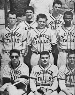 Joe Namath, with sunglasses, in portion of high school baseball team photo.
