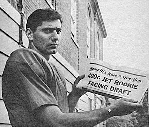 Joe Namath holds up newspaper headline in the summer of 1965 when he faced the military draft, but was deferred because of his knees.