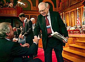 Warren Buffett greeting Jeffrey Immelt, CEO, General Electric, before panel discussion at Georgetown University, March 13, 2007 in Wash., DC, hosted by U.S. Treasury Secretary Hank Paulson. Photo, Chip Somodevilla.