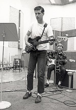 A very young Brian Wilson, foreground, with equally young David Marks behind him, in the studio, early ‘60s.