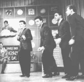 Danny & the Juniors appearing on “American Bandstand,” with Dick Clark at the podium, 1950s.