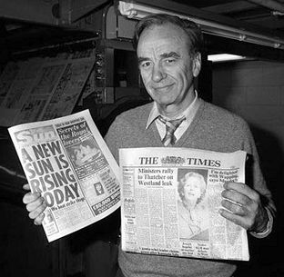 Rupert Murdoch shown with copies of his London newspapers “The Sun” and “The Times,” the latter of which he would acquire in 1981.