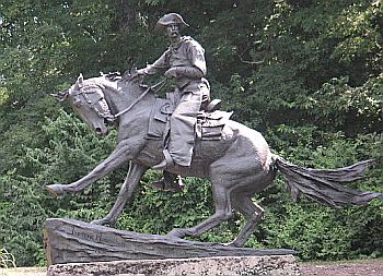 Frederic Remington’s “The Cowboy,” a large 1908 statue that stands today in Philadelphia, PA’s Fairmont Park. Click for sculpture.