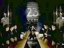 Newtork 23 corporate executives shown at board meeting where they can also monitor "intant tele-ratings."