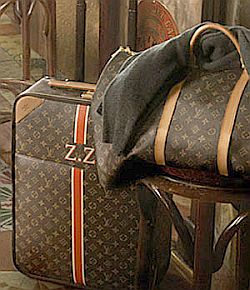 A monogrammed Louis Vuitton canvas bag from the ad showing initials “Z.Z.”