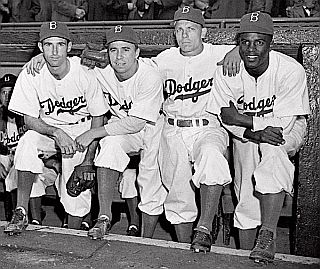 Brooklyn Dodgers players on opening day, April 15, 1947, from left: John Jorgensen, Pee Wee Reese, Ed Stanky and Jackie Robinson.