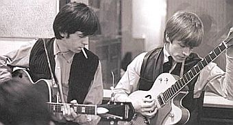 Keith Richards & Brian Jones comparing guitar licks,1960s.