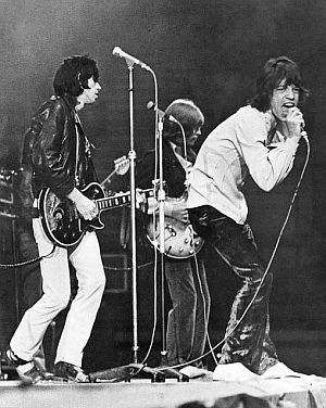 Mick Jagger on stage, with Keith Richards and Brian Jones behind him, as Stones debut “Jumpin Jack Flash” at a New Musical Express (NME) concert in the U.K., May 1968. Mick Jagger on stage, with Keith Richards and Brian Jones behind him, as Stones debut “Jumpin Jack Flash” at a New Musical Express (NME) concert in the U.K., May 1968.