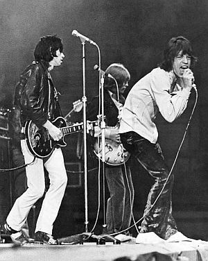 Mick Jagger on stage, with Keith Richards and Brian Jones behind him, as Stones debut “Jumpin Jack Flash” at a New Musical Express (NME) concert in the U.K., May 1968.