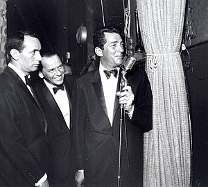 Joey Bishop, Frank Sinatra, and Dean Martin during a Rat Pack stage act in the 1960s.