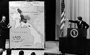 President Kennedy points to map of Laos at press conference in March 1961.