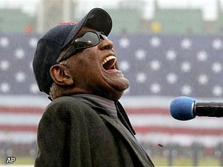 Ray Charles performing “America the Beautiful” at Fenway Park prior to a Boston Red Sox baseball game, April 2003.  AP photo.