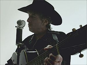 2006: Bob Dylan in Apple iPod+iTunes TV ad singing “Someday Baby.”  Click to view on YouTube.