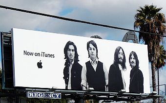 2010-2011: Billboard ads and building broadsides announcing availability of Beatles music on iTunes ran in major cities, this one along Sunset Blvd, Los Angeles, CA, November 2010.